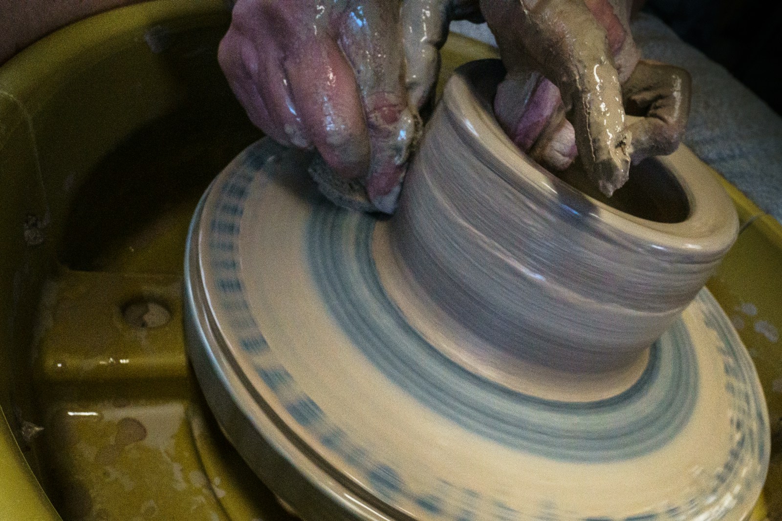 Clay pot being made on a pottery wheel
